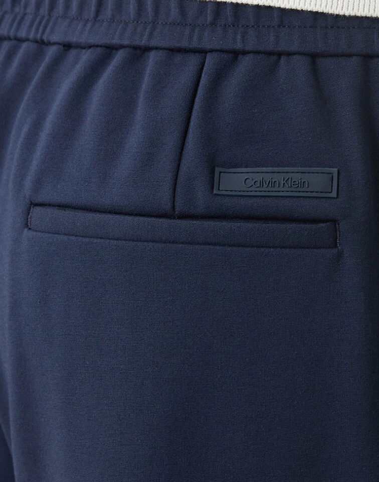 TAPERED TECH KNIT PLEATED PANT